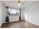 Simple bedroom with tile floors and window at 906 S Peoria St, Aurora, CO 80012