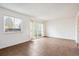 Living room with tile floors and patio access at 906 S Peoria St, Aurora, CO 80012