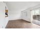 Living room with tile floors and access to patio at 906 S Peoria St, Aurora, CO 80012