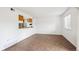 Living room with tile floors and kitchen pass-through at 906 S Peoria St, Aurora, CO 80012