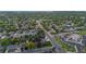 Neighborhood aerial view features tree-lined streets and a mix of residential homes at 5320 W 62Nd Ave, Arvada, CO 80003