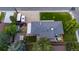 Aerial view of a home with a spacious driveway, fenced yard, hot tub, and well-maintained lawn at 5320 W 62Nd Ave, Arvada, CO 80003