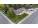 Aerial view of a fenced-in yard, brick home, and driveway with trailer parking at 5320 W 62Nd Ave, Arvada, CO 80003