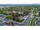 Aerial view showcases the neighborhood, landscaping, and surrounding area at 5320 W 62Nd Ave, Arvada, CO 80003