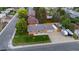 The aerial view showcases a home with a manicured lawn and RV parking at 5320 W 62Nd Ave, Arvada, CO 80003