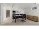 Open basement space with carpet, fireplace, workspace, and cozy furnishings at 5320 W 62Nd Ave, Arvada, CO 80003