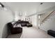 Spacious finished basement featuring a sectional sofa and carpet floors at 5320 W 62Nd Ave, Arvada, CO 80003