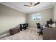 Cozy bedroom with a computer desk, storage, and a bright window at 5320 W 62Nd Ave, Arvada, CO 80003