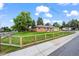 Beautifully maintained brick home with a lush green lawn and sturdy wooden fence at 5320 W 62Nd Ave, Arvada, CO 80003