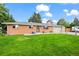 Charming single-story brick home with a well-manicured front yard and attached garage at 5320 W 62Nd Ave, Arvada, CO 80003