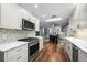 Lovely kitchen with quartz countertops, stainless steel appliances, and ample cabinet space at 5320 W 62Nd Ave, Arvada, CO 80003