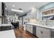 Well-lit kitchen with updated cabinets, countertops, and stainless steel appliances at 5320 W 62Nd Ave, Arvada, CO 80003