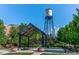 Park view featuring a water tower and picnic pavilion with landscaping and benches at 5320 W 62Nd Ave, Arvada, CO 80003