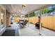 The patio features a grilling and dining area, with a hot tub in the background at 5320 W 62Nd Ave, Arvada, CO 80003