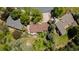 An aerial view of the house shows the roof, landscaping, and the house's position on the lot at 879 S Cole Dr, Lakewood, CO 80228