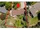 An aerial view of the house shows the roof, landscaping, and the house's position on the lot at 879 S Cole Dr, Lakewood, CO 80228