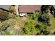 Aerial shot showcasing a private backyard, mature trees, and a wooden deck perfect for outdoor living at 879 S Cole Dr, Lakewood, CO 80228