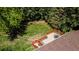 Aerial view of a backyard featuring a well-maintained deck and a serene, green surrounding at 879 S Cole Dr, Lakewood, CO 80228