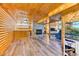 Finished basement with wood paneling, fireplace, and built in bar at 879 S Cole Dr, Lakewood, CO 80228