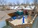 Aerial view of a home with a brick patio, fenced yard, and surrounding neighborhood at 4000 Irving St, Denver, CO 80211