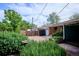 Well-maintained paver patio with a charming garden, lush greenery, and a private backyard at 4000 Irving St, Denver, CO 80211