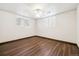 Bright bedroom features hardwood floors, modern fan, and window at 4000 Irving St, Denver, CO 80211