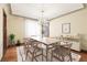 Formal dining room with a chandelier and seating for six at 4000 Irving St, Denver, CO 80211