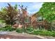 Charming brick home featuring a walkway, manicured lawn and attractive landscaping at 4000 Irving St, Denver, CO 80211