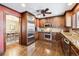 Spacious kitchen with stainless steel appliances and a view of the dining room at 4000 Irving St, Denver, CO 80211