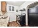 Modern kitchen with granite countertops and stainless steel appliances at 4000 Irving St, Denver, CO 80211