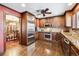 Well-equipped kitchen with stainless steel appliances, granite countertops, and hardwood floors at 4000 Irving St, Denver, CO 80211