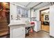 Functional laundry room with washer, dryer, sink and storage solutions at 4000 Irving St, Denver, CO 80211