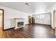 Inviting living room with cozy fireplace and beautiful hardwood flooring at 4000 Irving St, Denver, CO 80211