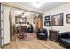 The living room boasts hardwood floors, vintage furniture, and decorative accents at 4000 Irving St, Denver, CO 80211