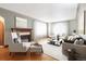 Bright living room with a fireplace, hardwood floors, and comfortable seating at 4000 Irving St, Denver, CO 80211