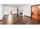 Bright living room featuring wood floors, fireplace, and open layout at 4000 Irving St, Denver, CO 80211