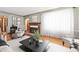 A well decorated living room with a fireplace and an archway entrance at 4000 Irving St, Denver, CO 80211