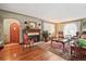 Elegant living room with hardwood floors, fireplace, and large windows with curtains at 4000 Irving St, Denver, CO 80211
