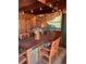 Covered outdoor seating area featuring wooden furniture and overhead string lights at 4000 Irving St, Denver, CO 80211