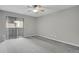 Spacious bedroom with a sliding door and a soft carpet floor at 3872 S Fraser St # O03, Aurora, CO 80014