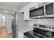 Efficient kitchen layout with stainless steel appliances and ample counter space at 3872 S Fraser St # O03, Aurora, CO 80014