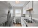 Contemporary kitchen with stainless steel appliances and a window for natural light at 3872 S Fraser St # O03, Aurora, CO 80014