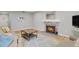 Cozy living room featuring a fireplace and comfortable seating arrangement at 3872 S Fraser St # O03, Aurora, CO 80014