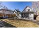 Spacious backyard with a well-maintained lawn, patio seating area, and privacy fence at 858 S Emerson St, Denver, CO 80209