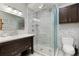 Modern bathroom with glass-enclosed shower, sleek vanity, and contemporary fixtures at 858 S Emerson St, Denver, CO 80209