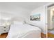 Cozy bedroom with white walls, neutral decor, and a comfortable queen-sized bed at 858 S Emerson St, Denver, CO 80209