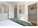 Nicely decorated bedroom featuring a closet with shelving and artistic prints at 858 S Emerson St, Denver, CO 80209