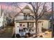 Charming two-story home with a covered front porch and decorative details under the gables at 858 S Emerson St, Denver, CO 80209
