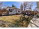 Charming house exterior with a spacious backyard, privacy fence, and well-kept lawn at 858 S Emerson St, Denver, CO 80209