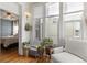 Charming sun room filled with plants, natural light, and a cozy sitting area at 858 S Emerson St, Denver, CO 80209